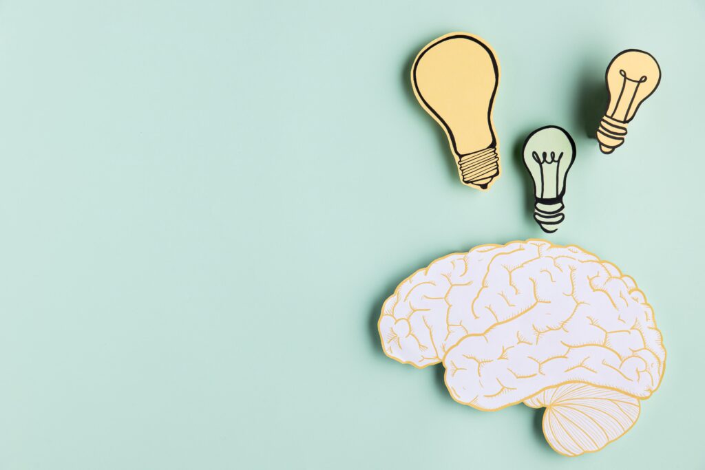copy space paper brain with light bulb